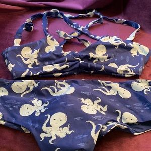 Size large fused octopus bikini top and bottom. Worn once